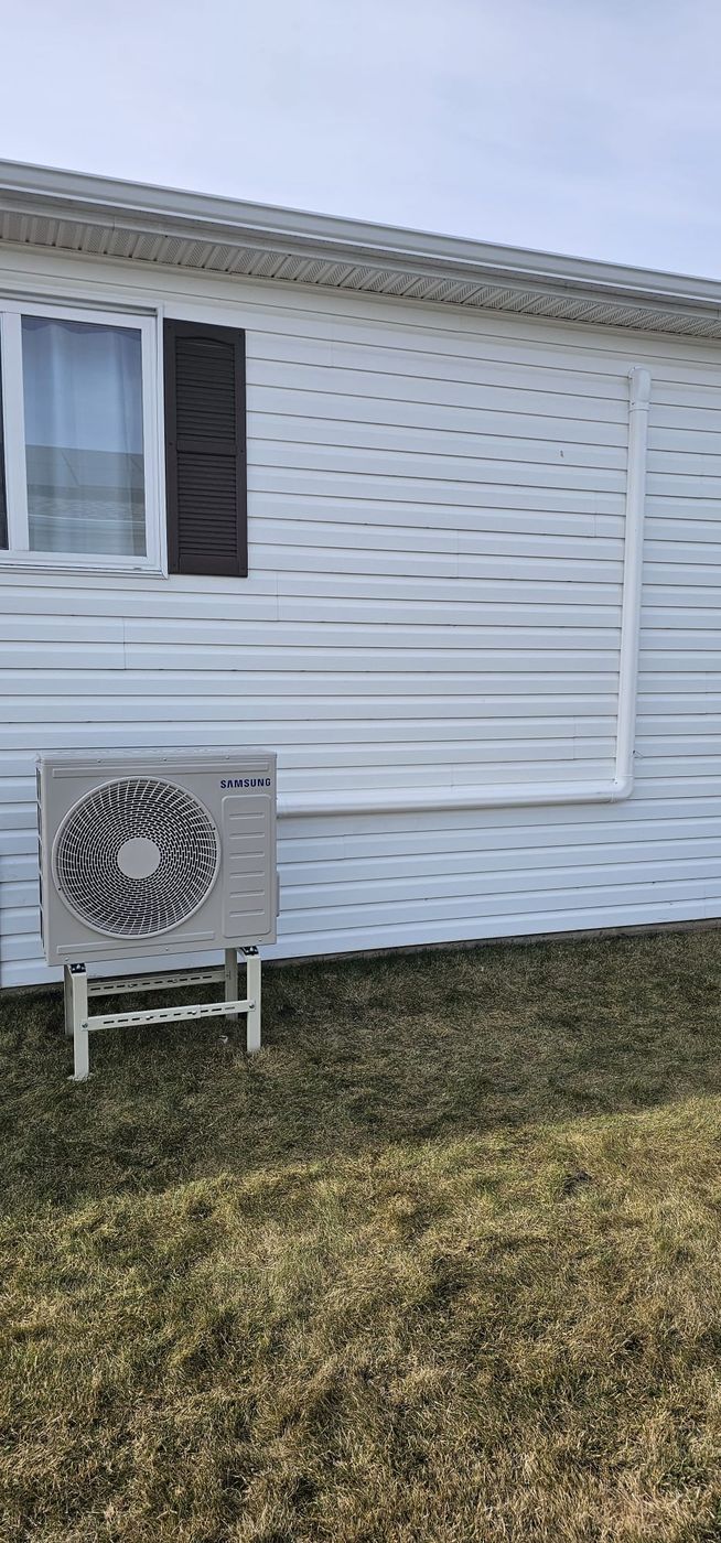 Wall-mounted condenser — residential install